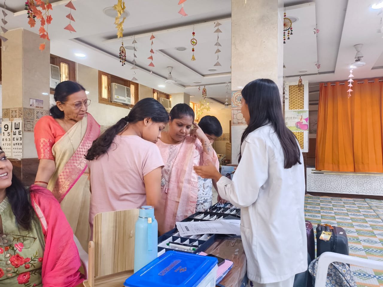 A family being checked together at the eye camp