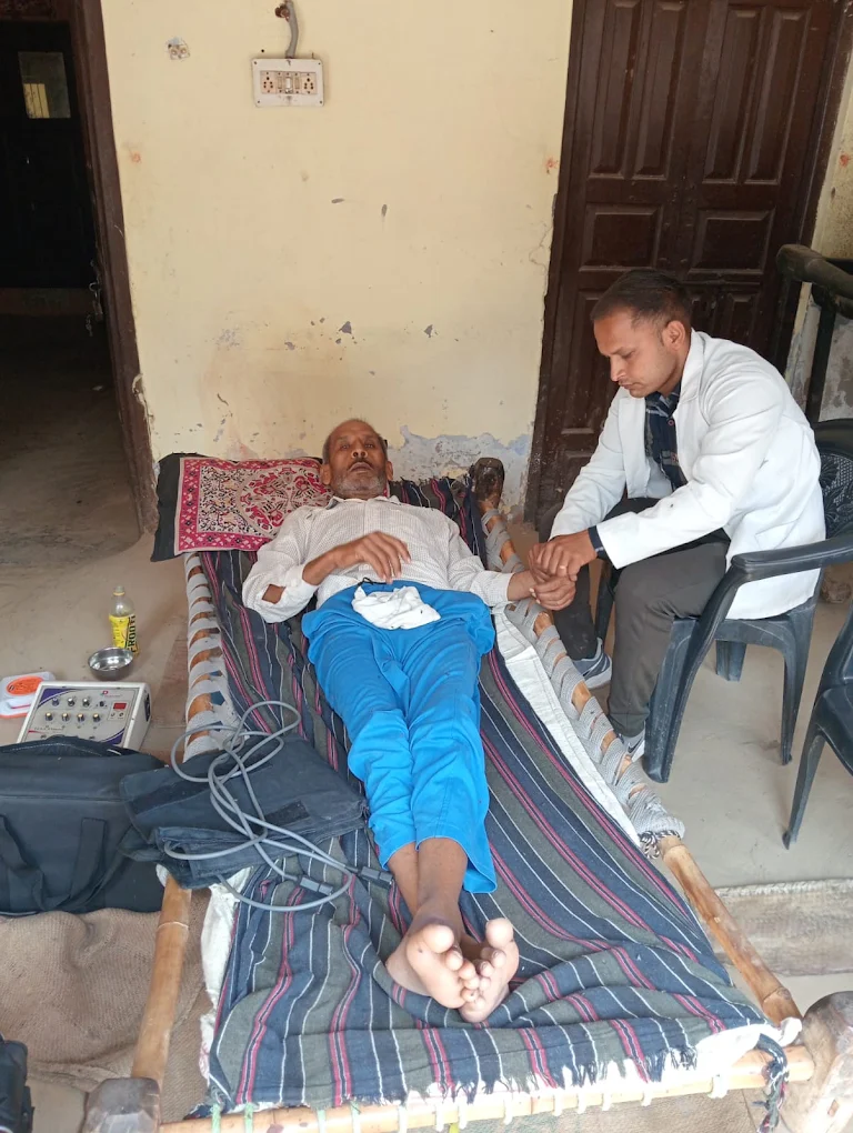 A physiotherapist attending to a patient at Dharatal Foundation, Baghpat